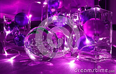 Christmas tree balls and jewellery with candle-lighted rally, in trend colour Ultra violet Stock Photo