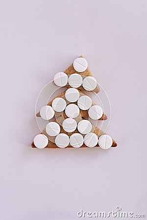 Christmas tree biscuits. White tablets. Light background Stock Photo