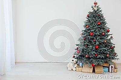 Christmas tree blue pine with gifts interior new year December postcard Stock Photo