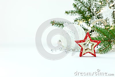 Christmas tree branch, glass balls and decorative wooden star Stock Photo