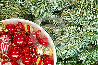 Christmas tree branches and Christmas decorations. Red balls and christmas tree branch Stock Photo