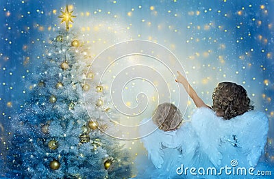 Christmas Tree and Children Looking to Star, Kids with Wings as Xmas Angels in Night Stock Photo