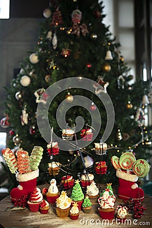 Christmas tree with cookies, cupcakes, balls, sweets, candy, ornaments Stock Photo