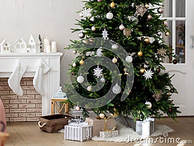 Christmas tree decorated in a bright room Stock Photo