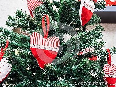 Christmas tree, decorated with colored cloth hearts Stock Photo