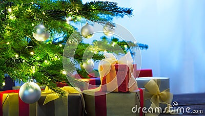 Christmas tree decorated with presents Stock Photo