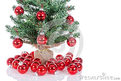 Christmas tree decorated with red balls isolated at white Stock Photo