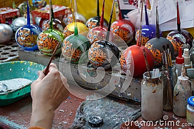 Christmas tree decoration tiger on hand. Symbol of the year 2022. Stock Photo