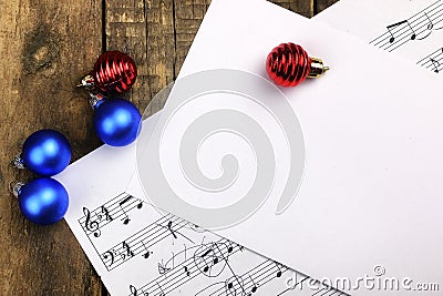 Christmas tree decorations on the table and sheet with music not Stock Photo