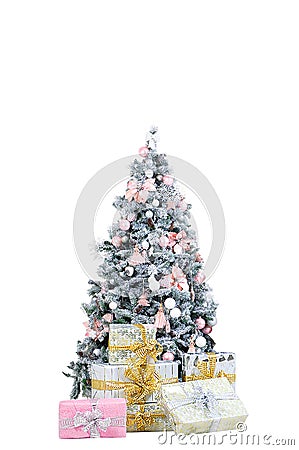 Christmas tree in decorative ornaments. With gift boxes on the floor Stock Photo