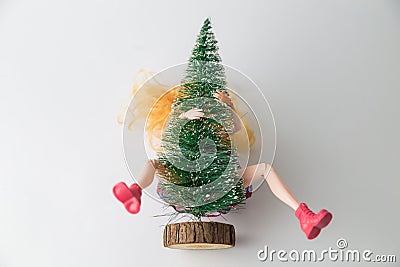 Spread legs doll covered with fir tree winter holidays making love abstract Stock Photo