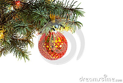 Christmas tree fir branch with hanging handmade craft new year toy ball pattern from red beads Stock Photo