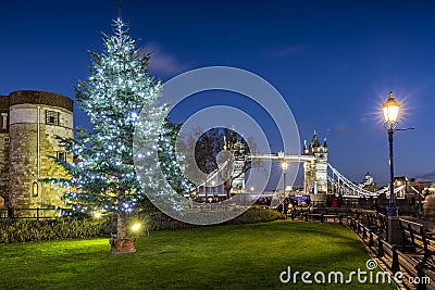 Christmas tree in front of the iconic Tower Bridge in London Stock Photo