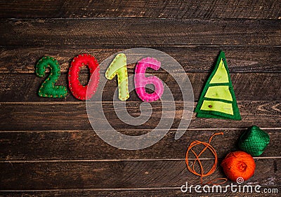 2016 Christmas tree made of felt. Childish New year background. Stock Photo