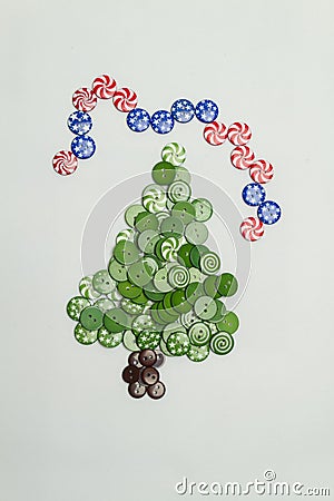 Christmas tree made with colorful buttons and american flag on white background Stock Photo