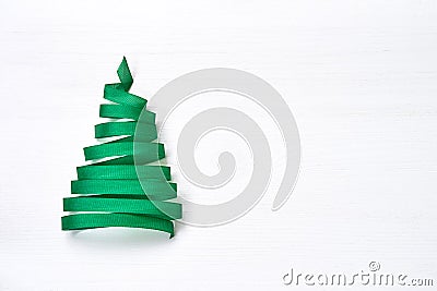Christmas tree made from green ribbon on white background. Stock Photo