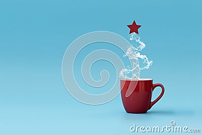 Christmas tree made of steaming coffee with red star. Morning drink. Christmas or New Year celebration concept. Copy space Stock Photo