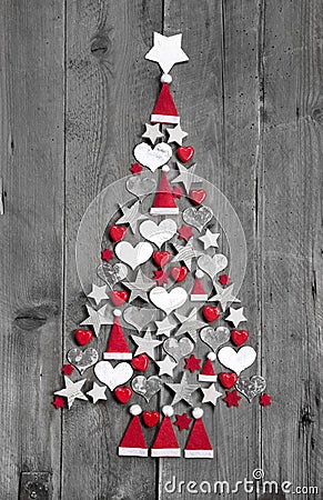 Christmas tree made up of decoration on grey wooden background Stock Photo