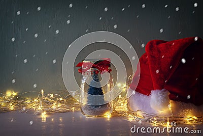 christmas tree in mason jar with garland warm lights Stock Photo