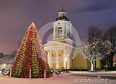 Christmas tree near church at new year eve Stock Photo