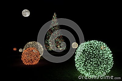 Christmas Tree at Night with Full Moon Stock Photo