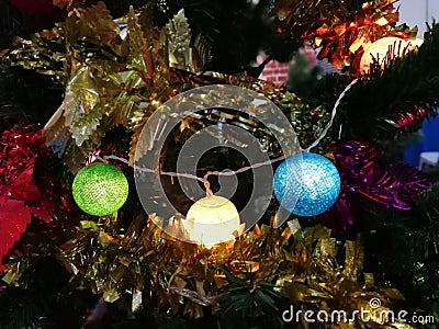 Christmas tree ornaments, colorful light balls on Christmas tree Stock Photo