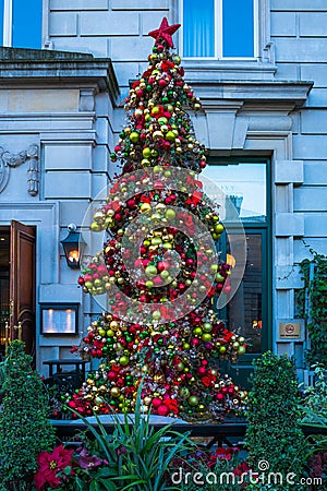 Christmas tree outside The Ivy Market, restaurant in Covent Garden Editorial Stock Photo