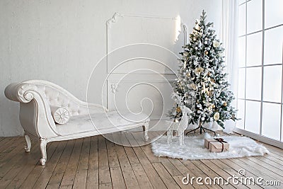 Christmas tree with presents underneath in living room Stock Photo