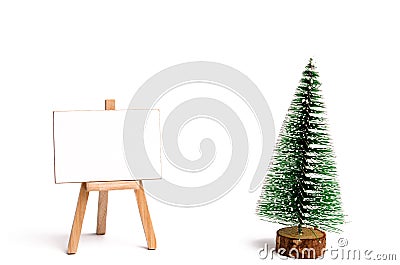 Christmas tree ready to decorating and stand with canvas for text on an isolated white background. New Year`s holidays. Christmas Stock Photo