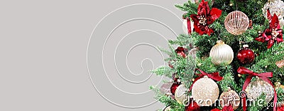 Christmas tree red ornaments baubles lights. Long banner Stock Photo