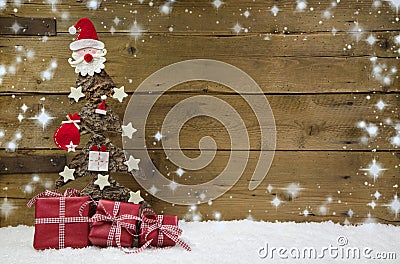 Christmas tree with red presents and snowflakes. Stock Photo