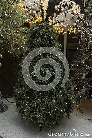 Christmas tree for sale with artificial decoration of non-real organic and realistic pine Stock Photo