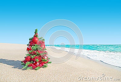 Christmas tree at sea beach. New Years vacation concept. Stock Photo