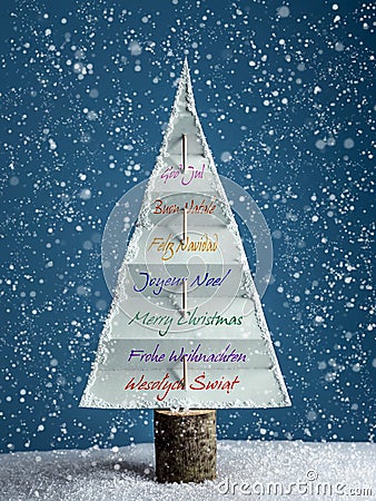 Christmas tree with seasonal greetings Stock Photo