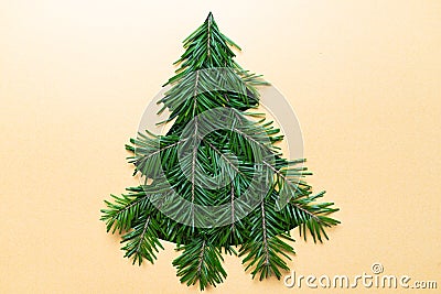 Christmas Tree shape cutout with branches. Christmas concept. Selective focus. Shallow DOF. Flat lay Stock Photo