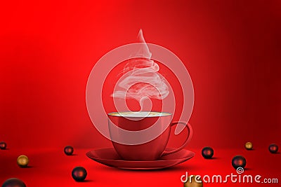 Christmas tree shape of steaming coffee cup and christmas ball on floor on a red background. Copy Space Stock Photo