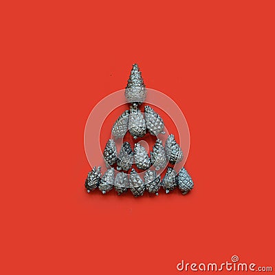Christmas tree of silver fir cones on a red background Stock Photo