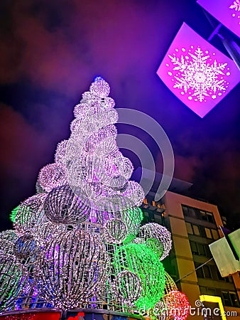 Christmas Tree on Smithfield Sq. Dublin, Ireland, Celebration, New Year, Neon, light, City, Night, Snow, winter, expectations Stock Photo