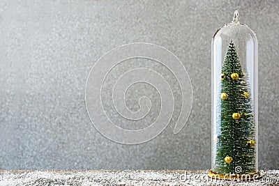Christmas tree and snow on bright gray background. Stock Photo