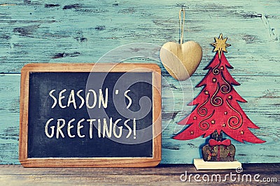 Christmas tree and text seasons greetings in a chalkboard Stock Photo