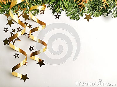 Christmas tree toys, golden stars and fir branch on a white background. Christmas decorations. Greetings card. Stock Photo