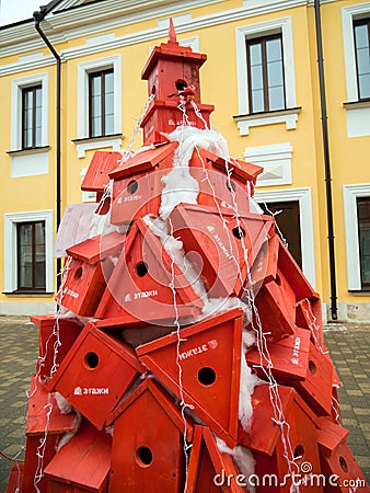 Christmas tree from wooden birdhouses. Festival of creative Christmas trees on Metallistov street Editorial Stock Photo