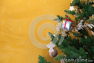 Christmas tree with yellow background Stock Photo