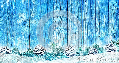 Christmas trees and cones background on blue wooden board and snow Stock Photo