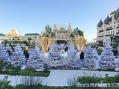 Christmas trees and fake snow at Casino Square, Monte Carlo, Monaco Editorial Stock Photo