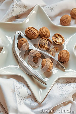 Christmas walnuts plate with nutcracker Stock Photo