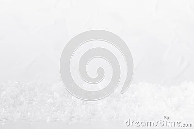 Christmas white frosty shiny bright snowflakes and fake snow as snowdrift with blur as abstract winter background, closeup. Stock Photo