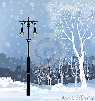 Christmas Winter Cityscape with luminous street light, snow Stock Photo