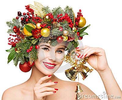 Christmas Woman Gift Bells. Beautiful Girl Fashion Make up and Xmas Party Wreath Hairstyle. Isolated White Stock Photo