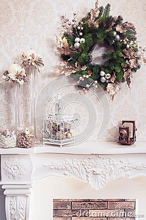 Christmas wreath above classical fireplace Stock Photo